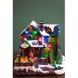 Villagio di natale baita con elfi  25,5 cm con musica movimenti e luci
