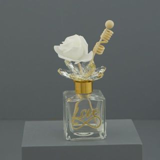 Diffusore per ambiente in vetro con scritta Love e rosa bianca