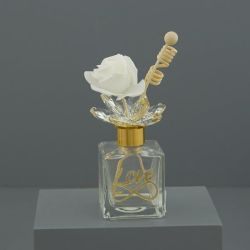 Diffusore per ambiente in vetro con scritta Love e rosa bianca