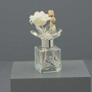 Diffusore per ambiente in vetro con decoro inciso e fiore