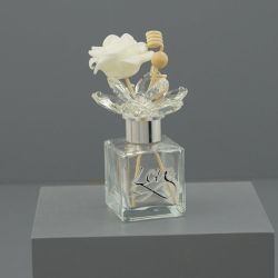Diffusore per ambiente in vetro con decoro inciso e fiore