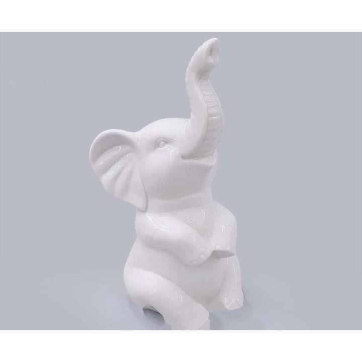 Elefante seduto bianco lucido