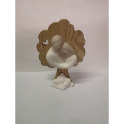 Coppia sposi in porcellana su albero in legno 9,2x3,2x14,2 cm.